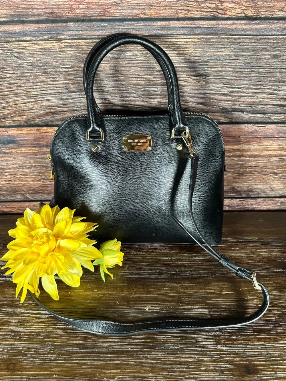 Michael Kors Cindy Medium Dome Satchel in leather with gold-tone hardware.